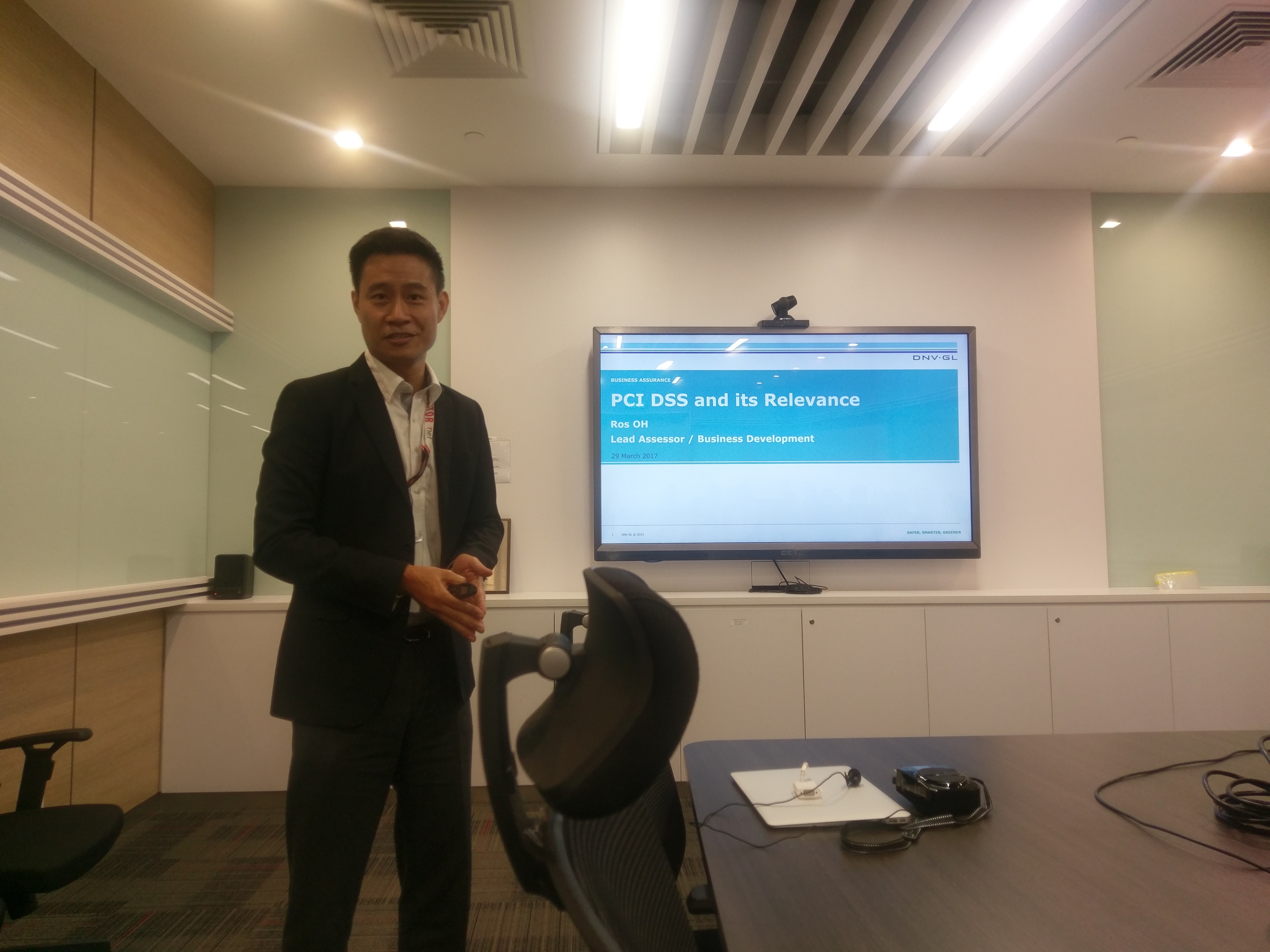 Ros Oh from DNV GL speaking on PCI DSS at an event with 1-Net