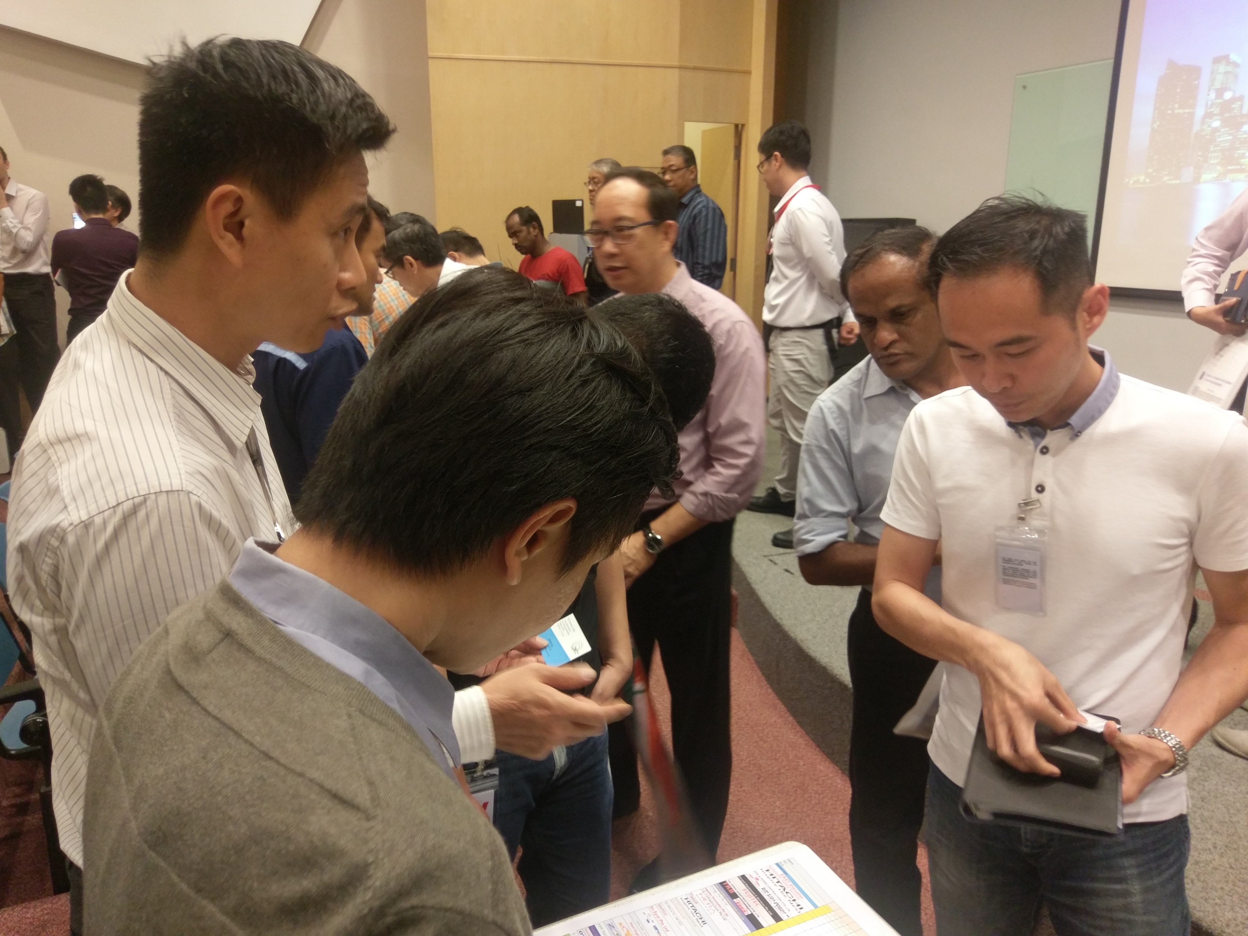 Representatives from DNV GL meeting Singtel sub-contractors to discuss certification opportunities